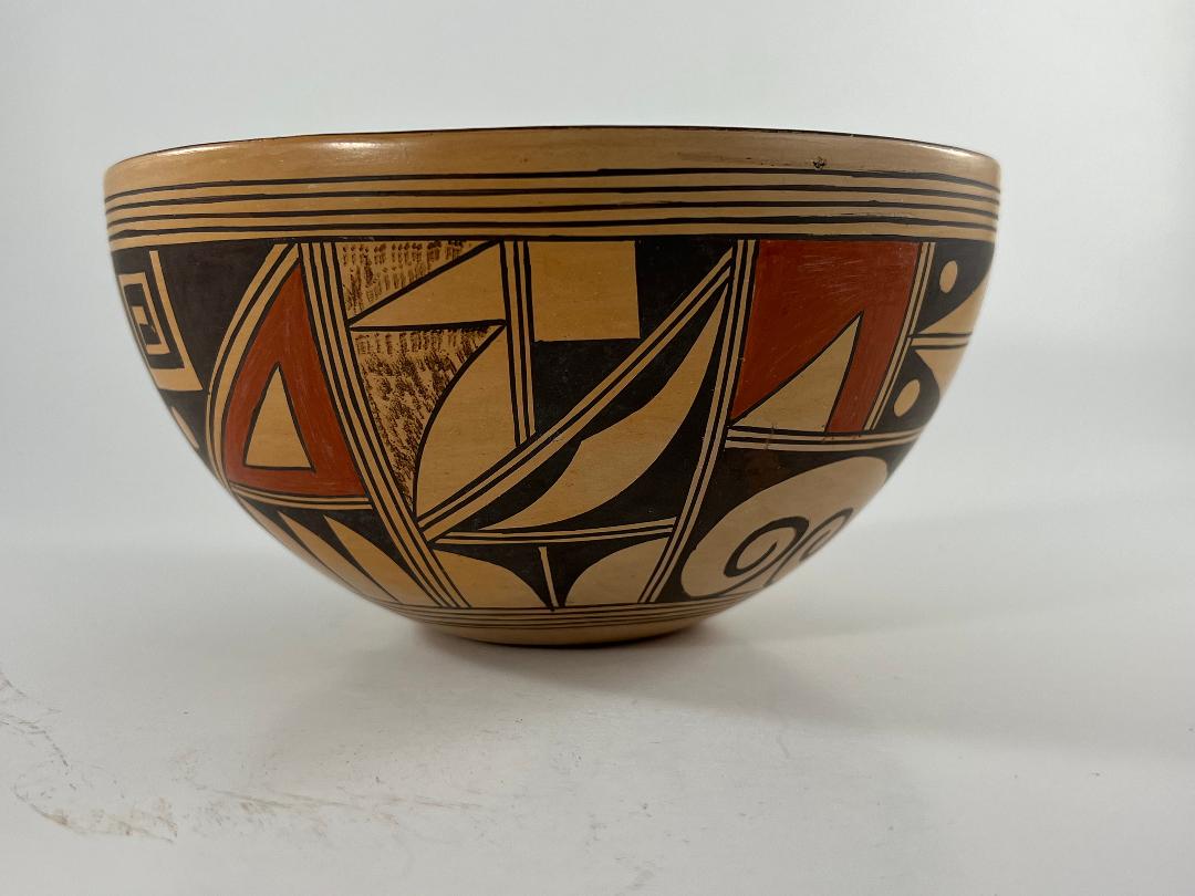 2021-08  Bowl with geometric and curvilinear designs